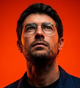 Uplooking Editorial Portrait on Orange-Red