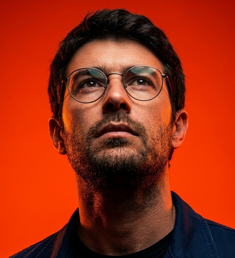 Uplooking Editorial Portrait on Orange-Red